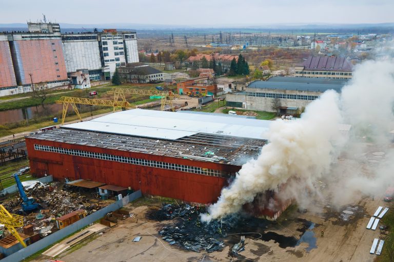 aerial-view-of-firefighters-extinguishing-fire-in-